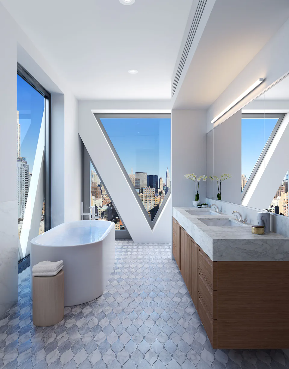 Rendering of the penthouse primary bathroom with an elliptical tub, a walnut vanity and hourglass Carrara and Bardiglio marble floor tiles beneath a lattice window at Midtown Luxury Residences, 30 East 31 Street, New York City, interior design by Alexandra Peck Design